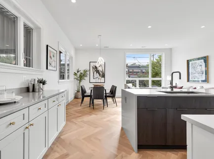 Kitchen and dining area with herringbone floors