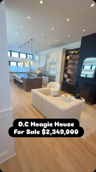 Modern kitchen and living area with feature wall